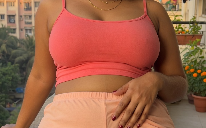 hot desi girl standing her balcony wearing sexy tight shorts